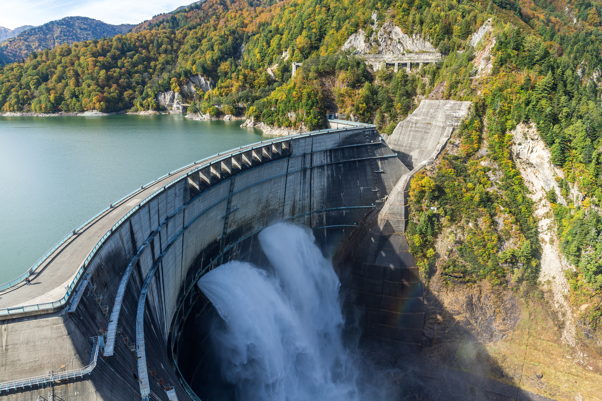 Water gushes out of a dam.