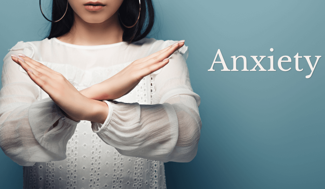 A woman crossing her arms. What anxiety isn't.