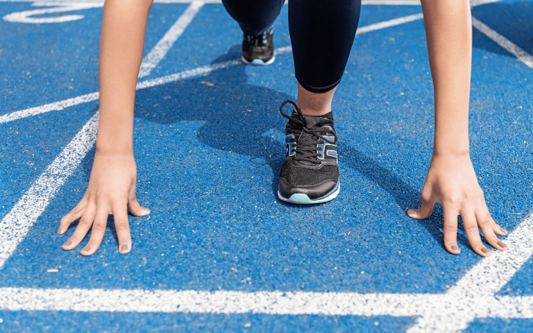 Woman at start line, ready to run. 