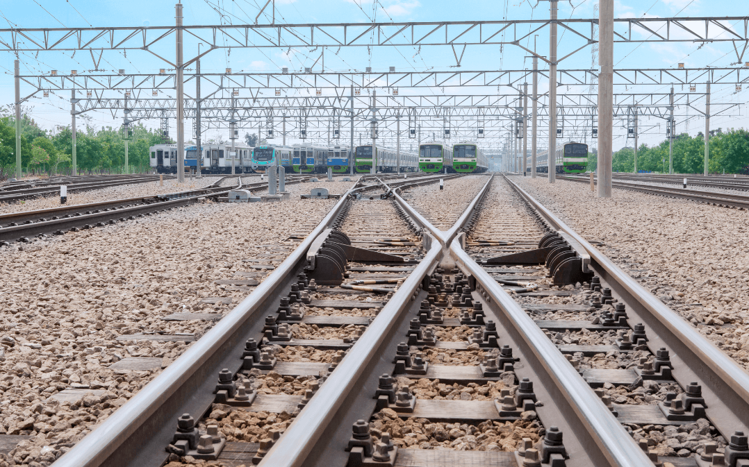 Two train tracks at a junction symbolising a shift in direction.