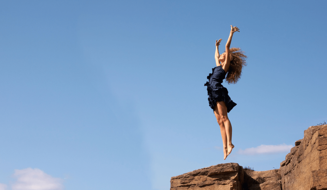 A woman jumping with excitement.