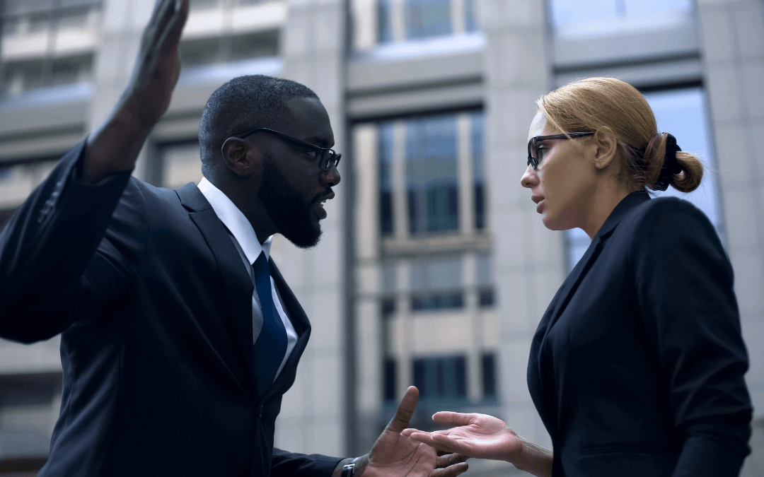 Man and woman explaining themselves to each other.