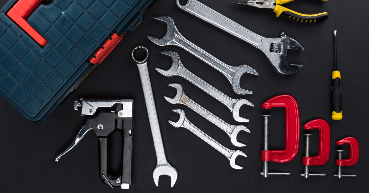 A toolbox surrounded by different tools.